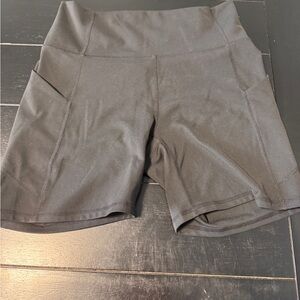 Fabletics PureLuxe Black High-Rise Bike Shorts with Side Pockets